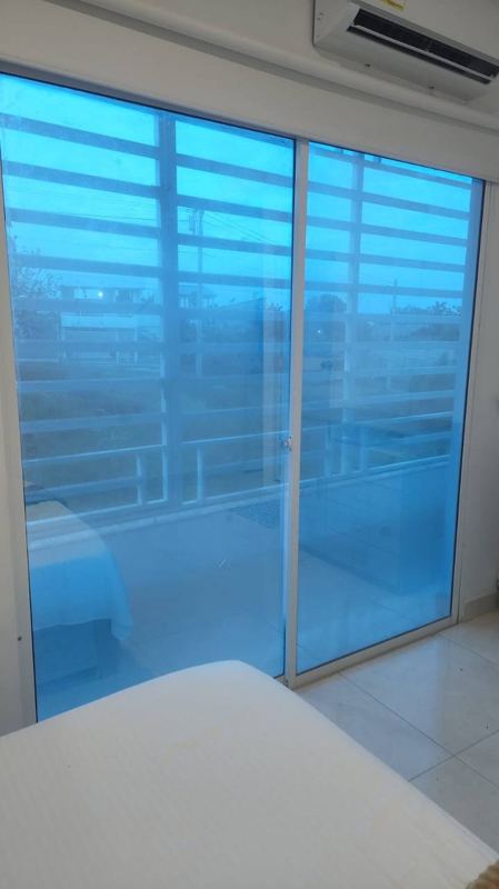 Bedroom with double bed, balcony and air conditioning