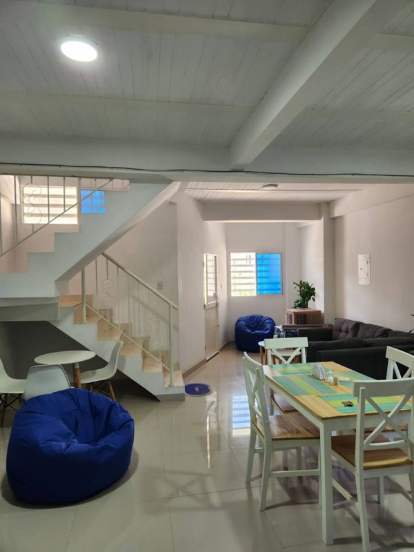 Bright living and dining area with stairs to the upper floors